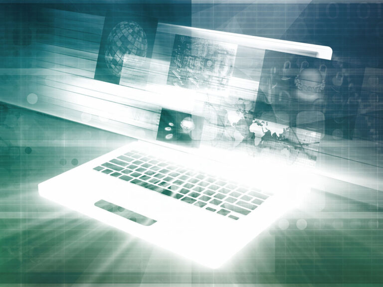 Blurry computer with images of earth etc