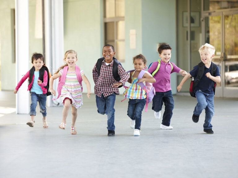 Group of school children running