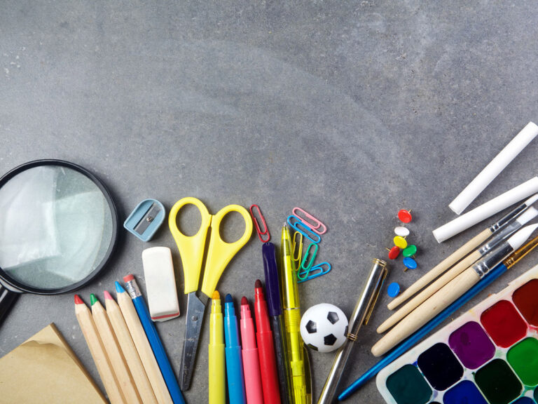 school supplies on blackboard background