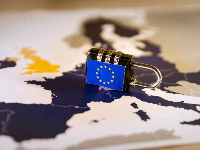 EU Flag on lock on top of world map